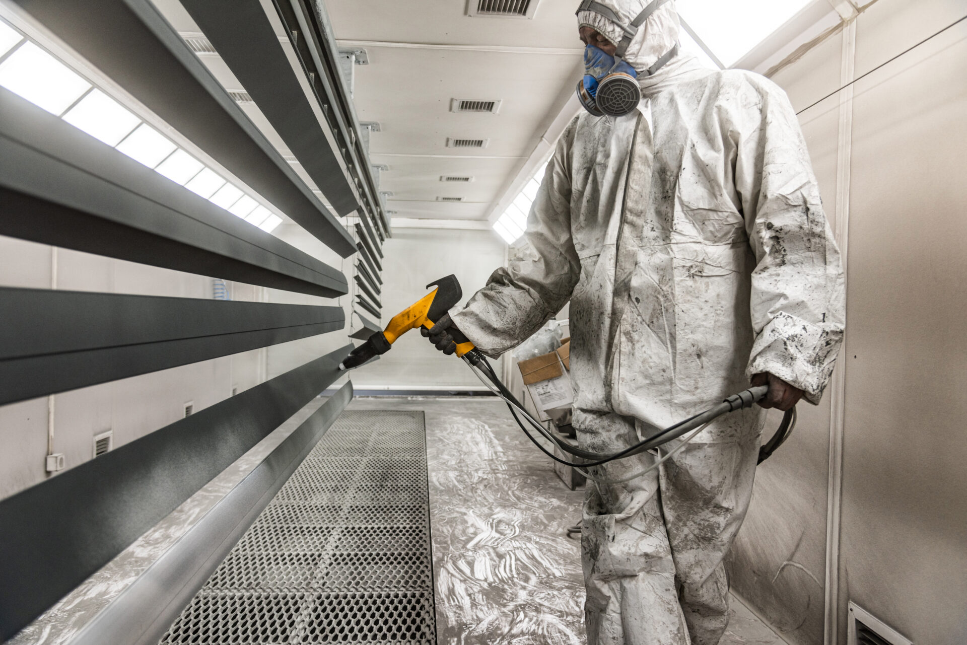 The craftsman paints structural elements in the painting box